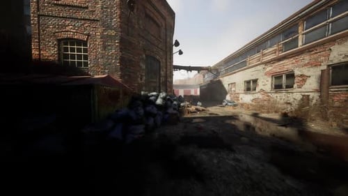 Abandoned Factory with Collapsing Brick Buildings and Overgrown Debris