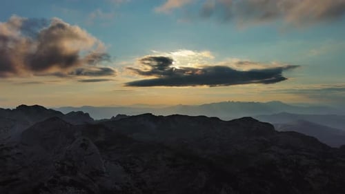 Sunset Over Mountain with Dramatic Clouds