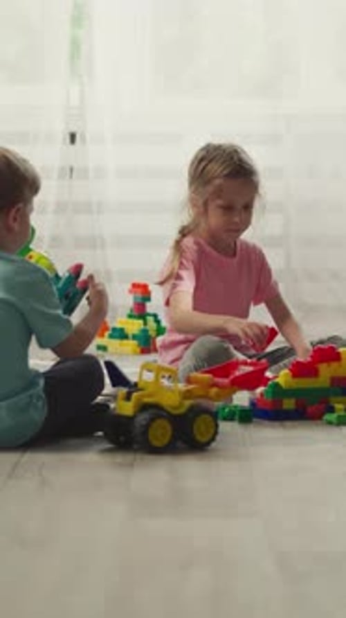 Children Building with Blocks in Bright Room
