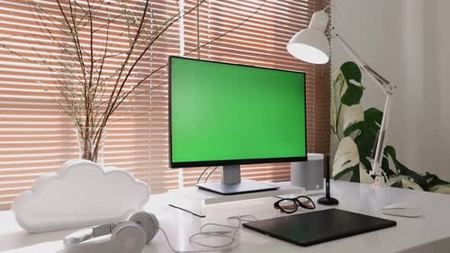 Dolly in computer display monitor with green screen chroma key mock-up.