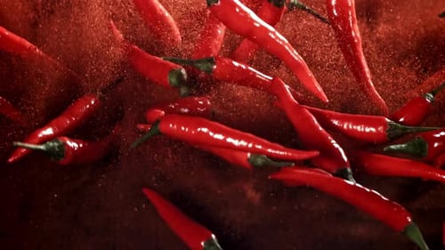 Red Chili Pepper in Flight with Ground Pepper Filmed on a Highspeed Camera at 1000 Fps