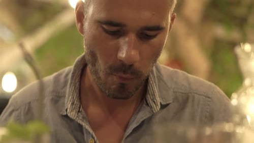 Young Man Eating Meal in Cafe 30s