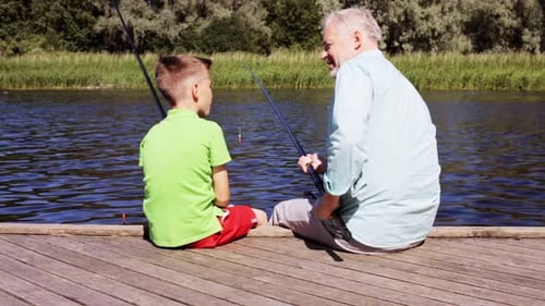 Family, Generation, Summer Holidays and People Concept - Happy Grandfather and Grandson