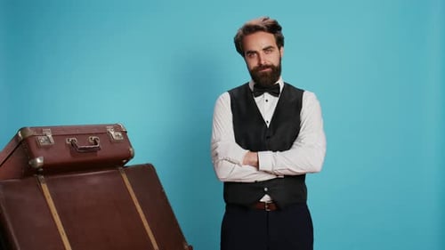 Confident Bellboy Posing on Camera