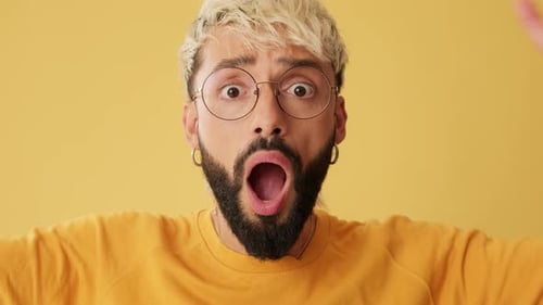 Man With Beard Reacting in Surprise