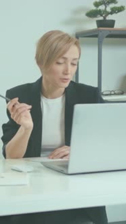 Attentive Office Manager Systematically Outlining Project Timelines with Careful Attention to Detail