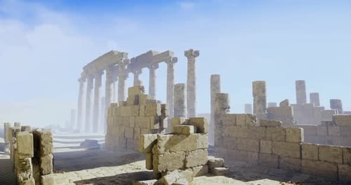 Ancient Ruins with Towering Columns Under a Blue Sky in a Misty Landscape