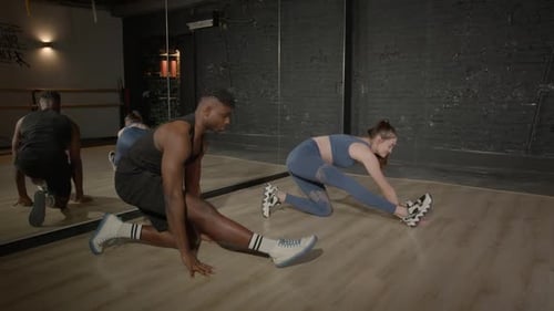 Active Fit Diverse People Performing World's Greatest Stretch Exercise at Gym