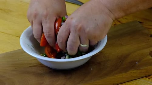 the chef mixing the salad