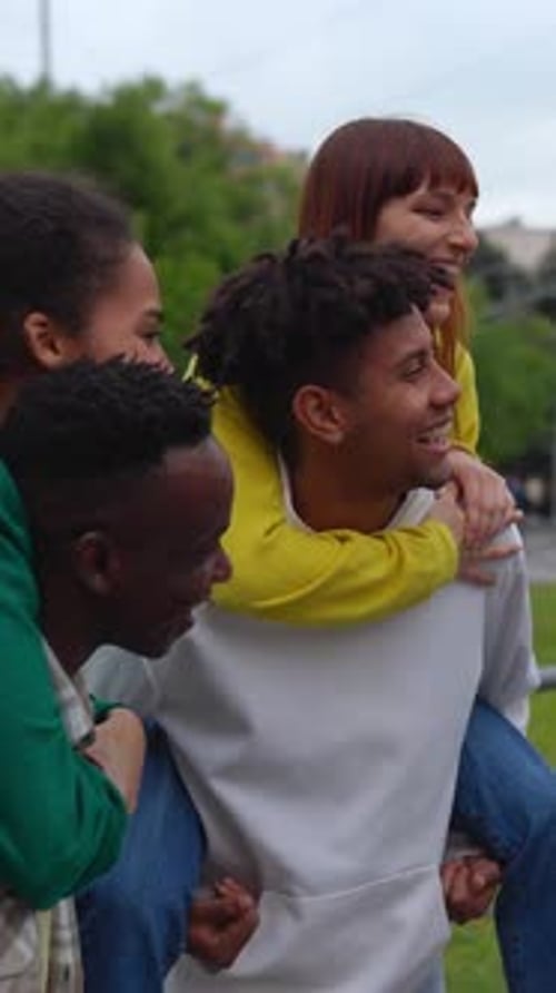 Multiracial Young Friends Having Fun Together at City Street