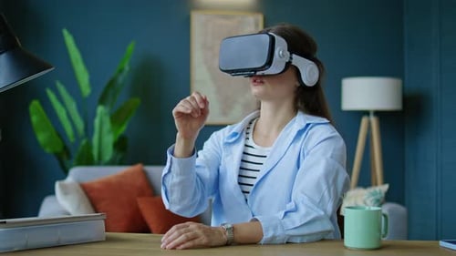 Woman Wearing VR Headset Interacting with Virtual Environment