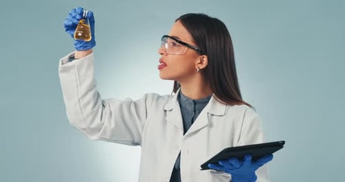 Doctor, tablet and reaction with a science woman in studio on a gray background for research