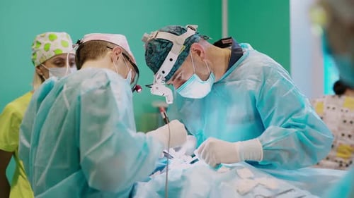 Team of doctor performing surgery. Surgical team performing surgery in modern operation theater