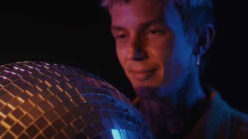 Young Adult Holding a Disco Ball