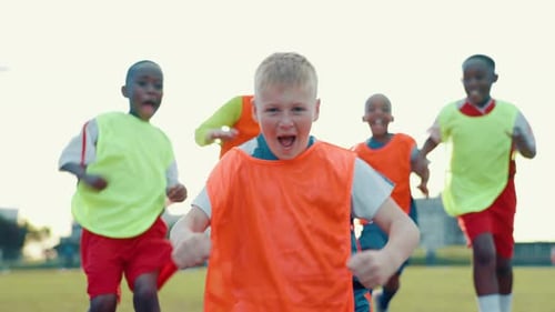 Soccer, winner and face of boys on field for celebration, competition and teamwork with victory