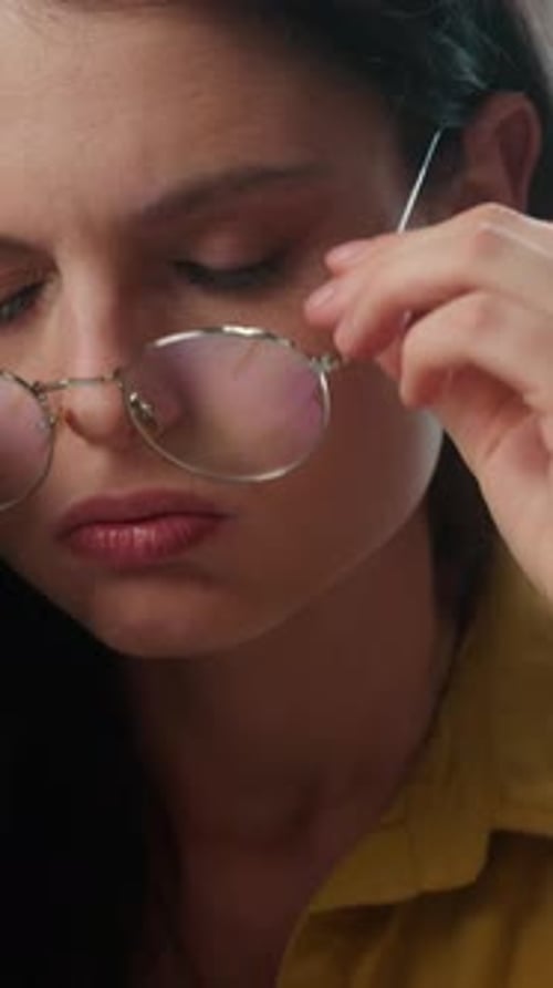 Tired Stressed Caucasian Female Student Taking Off Eyeglasses Reading Book in Library Exhausted