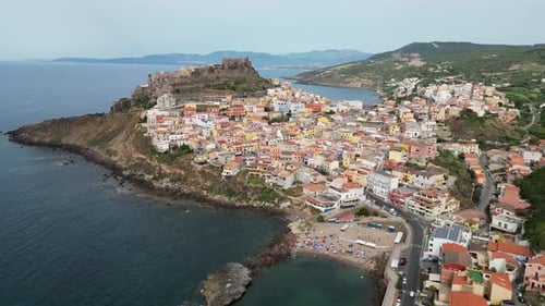 Castelsardo beach, castle and colorful, fortified town in Sardinia, Italy - 4k Drone Aerial