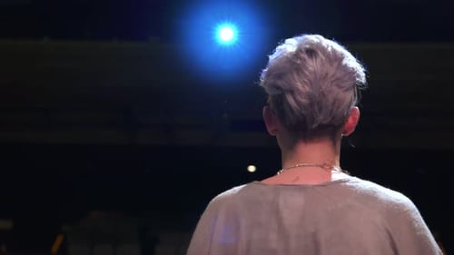 Singer Under Spotlight on Stage Performance