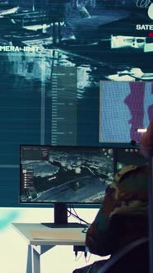 People Watching Satellite Data in Dark Government Office
