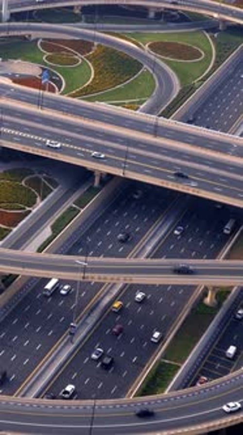 An Aerial Perspective Showcase of an Urban Highway Interchange with Active Traffic Flow