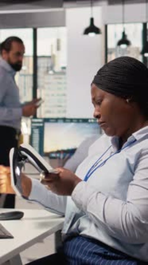 Engineer in Office Testing Innovative Solar Powered Device Turning Lights on