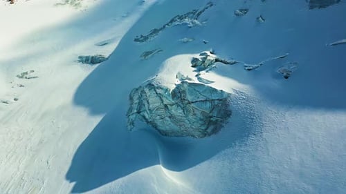 Aerial View of Snowy Mountains and Glacier Rock Formation