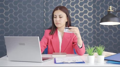 Young business woman shopping with credit card.
