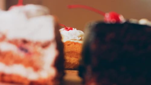 Close Up of Cake Slices with Cherries