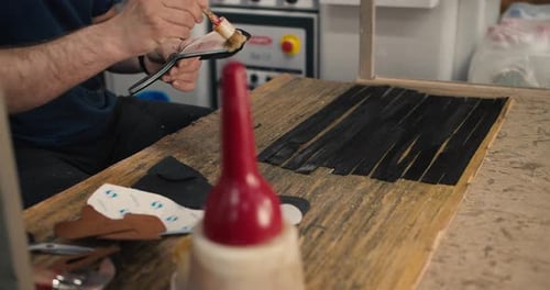 Shooting Up Close Handmade with Strips of Leather Creating a Shoe Fragment at the Primary Stage of