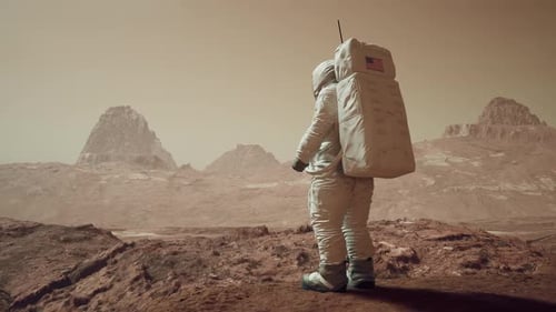 Astronaut Walks To Edge Of A Cliff To View Mars Surface 1