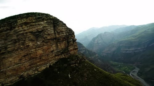 Cliff Overlooking Mountainous Valley Aerial View