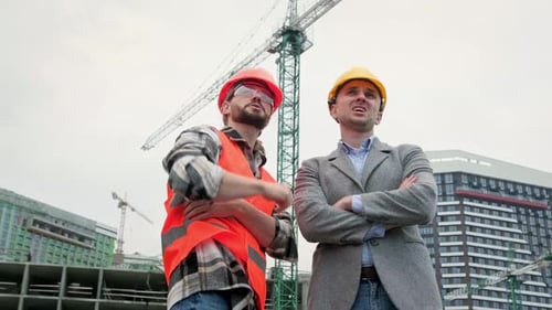 Building Contractors Discussing Something During Site Inspection
