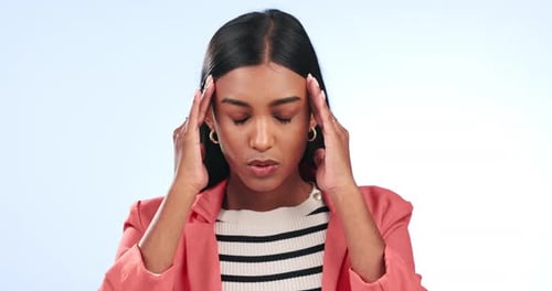 Woman, stress and headache or pain for news, student crisis or finance mistake on blue background