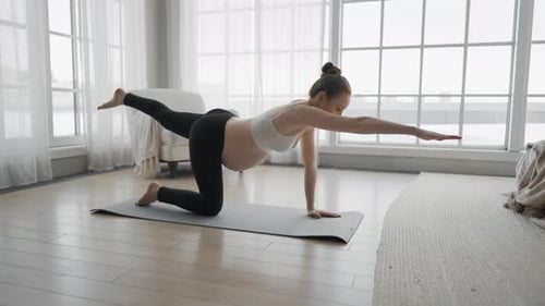 Pregnant Woman Doing Yoga Exercise at Home