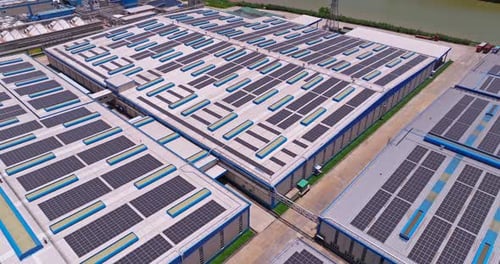 Aerial of Factory Rooftop Solar Panels