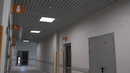 Empty Hospital Hallway With Disability Access Signage