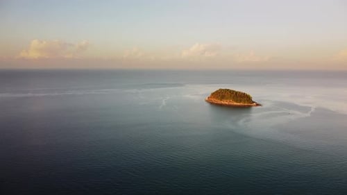 Lonely Small Inhabited Island Surrounded By Endless Ocean is Filmed By Drone