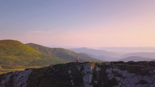 Tourist Hiker with a Backpack Walking on Mountain Path in Carpathian Mountains Man Tourist Hiking