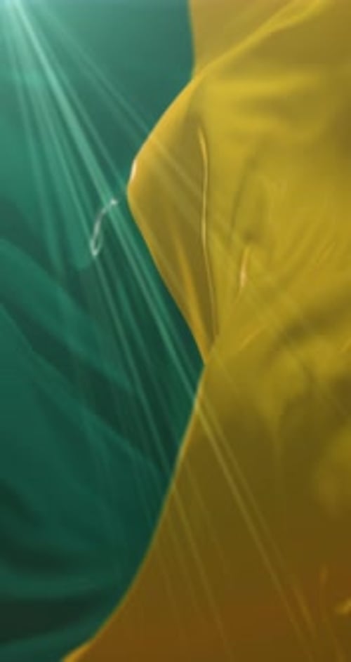 Abstract Fluid Yellow Fabric Flowing on Teal Background