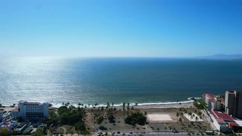 empty beachfront shoreline of Puerto Vallarta Mexico on sunny day, aerial