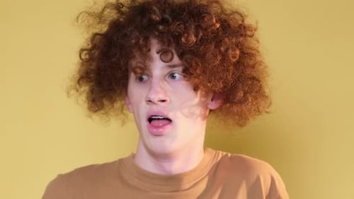 Young Adult Reacts with Surprise and Discomfort