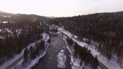 AERIAL SHOT OVER FROZEN RIVER
