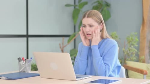 Woman Reacts to Bad News on Laptop