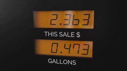 Digital Gas Pump Display Showing Increasing Fuel Price and Gallons