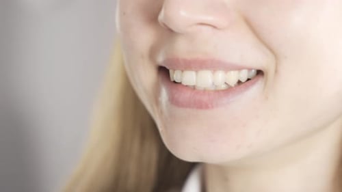 Female mouth speaking in close-up.