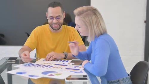 Business Professionals Analyzing Data in an Office