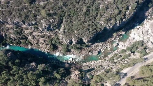 Drone shot of a River flowing through a canyon from above