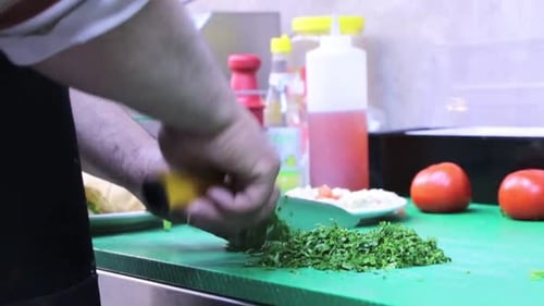 chef cutting vegetables & decorate a salad dish