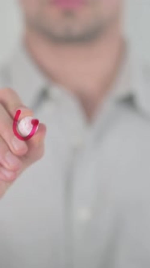 Man Writes Word User on Glass Surface