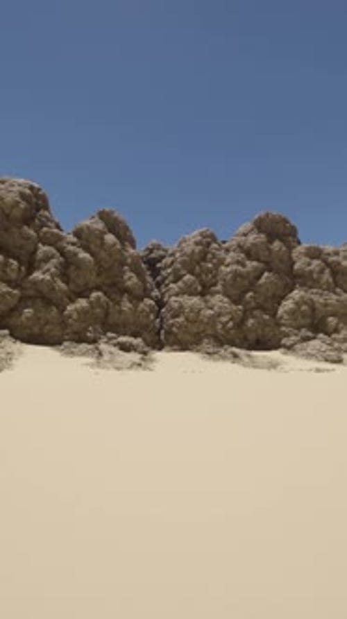A Large Rock Formation in the Middle of a Desert